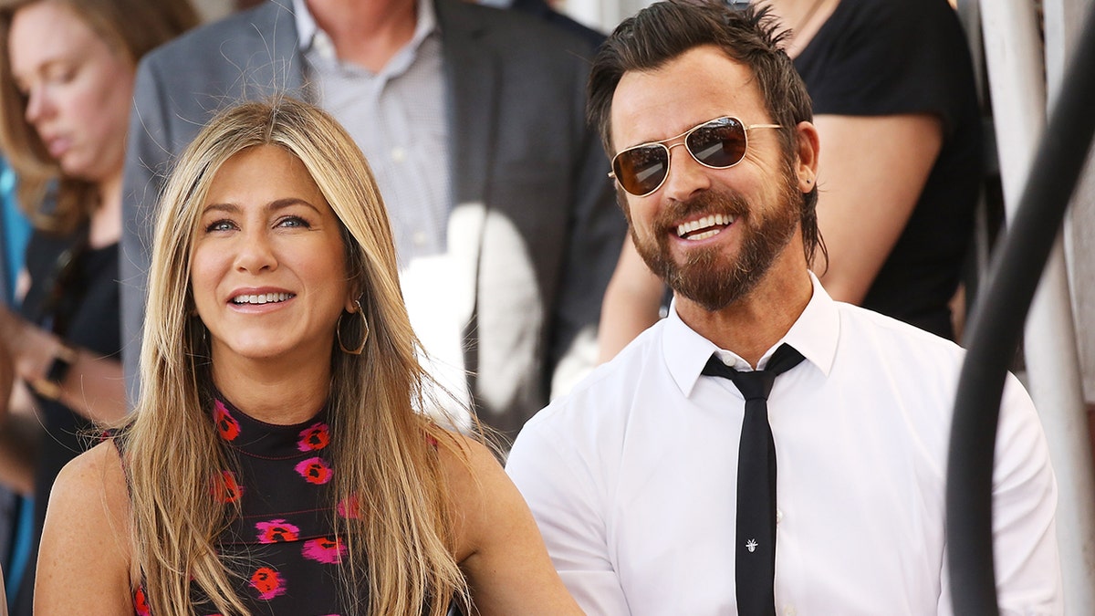 Jennifer Aniston and Justin Theroux attend an event