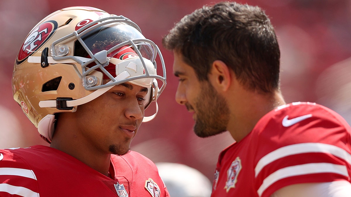 Jimmy Garoppolo and Trey Lance next to each other