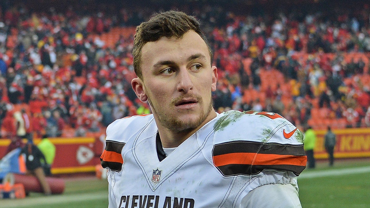 Johnny Manziel looks on field