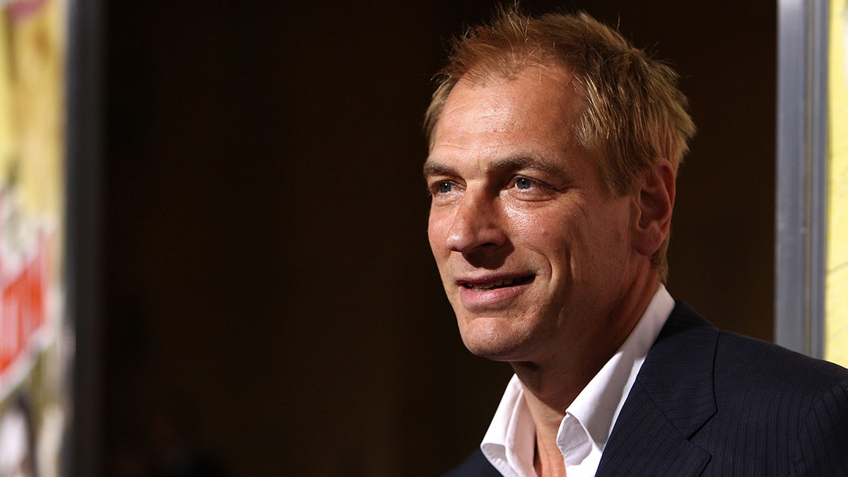 Julian Sands smiles for a photo