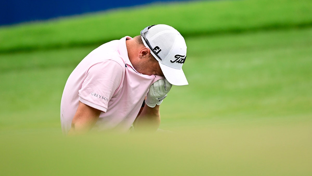 Justin Thomas reacts after missing chip