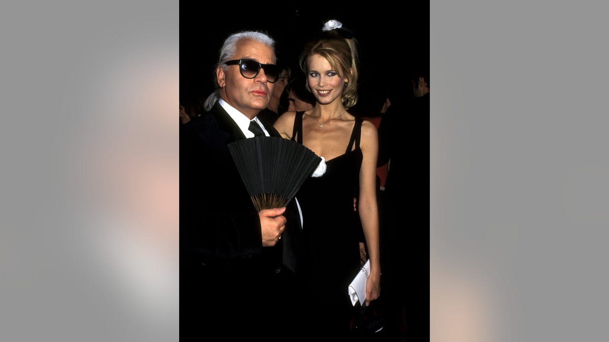 Karl Lagerfeld and Claudia Schiffer posing together