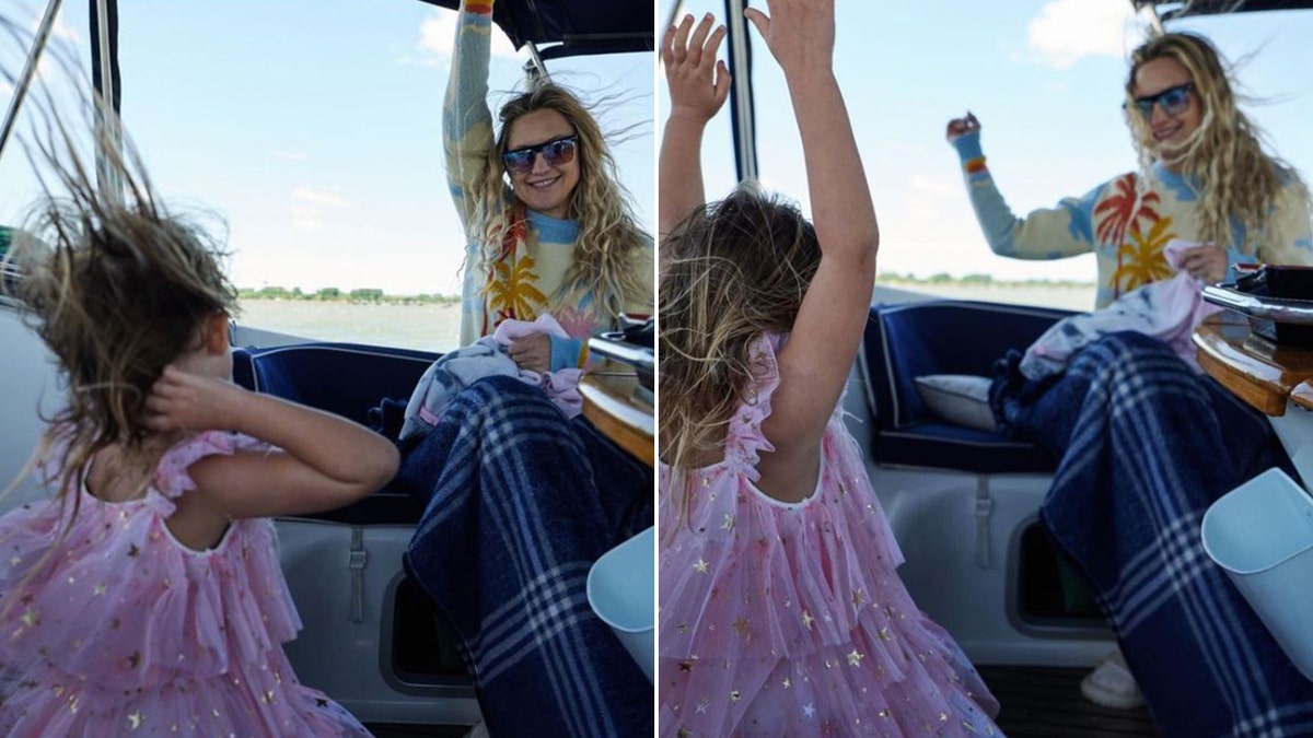 Kate Hudson and her daughter dancing on a boat