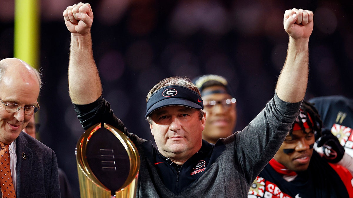 Kirby Smart holds the trophy