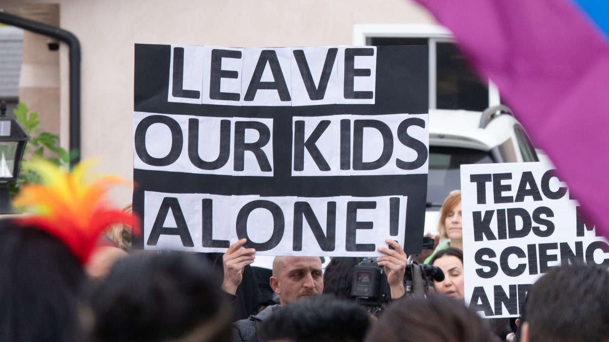 Leave our kids alone sign