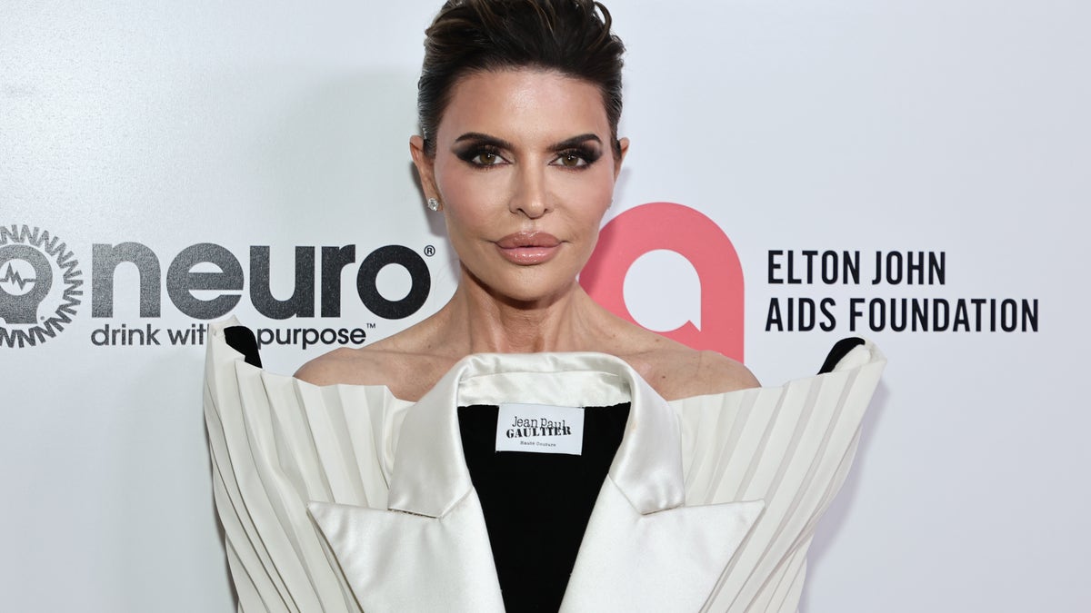 Lisa Rinna poses on the red carpet at the Elton John AIDS Foundation event