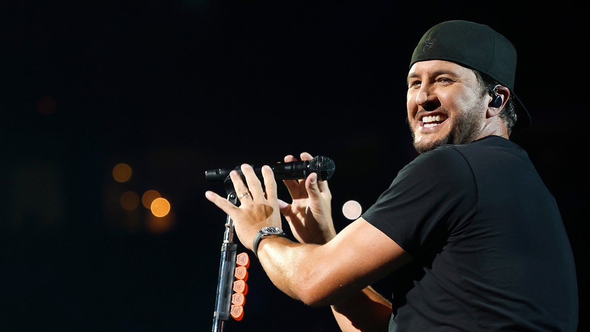 Luke Bryan on stage singing