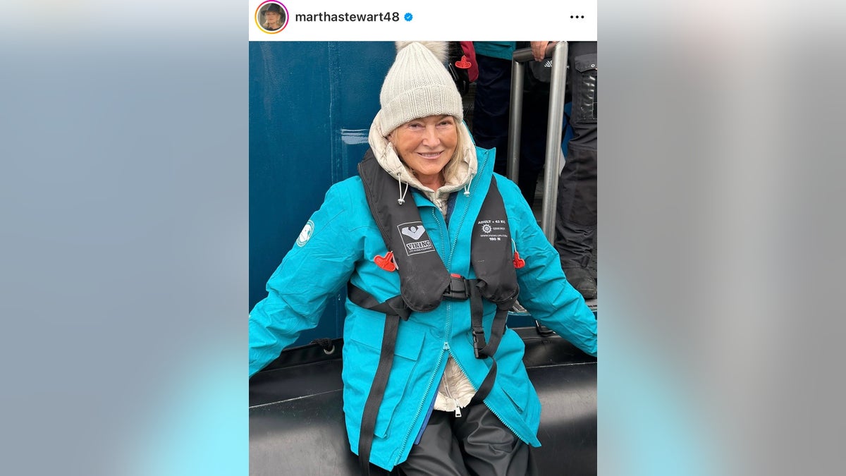 Martha Stewart poses in winter gear on the deck of a ship