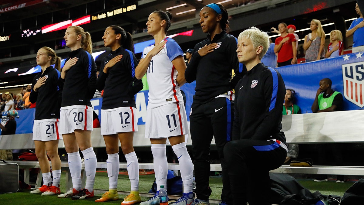 Megan Rapinoe #15 kneels during the national anthem prior to the match between the United States and the Netherlands at Georgia Dome on September 18, 2016 in Atlanta, Georgia. (Photo by Kevin C. Cox/Getty Images)