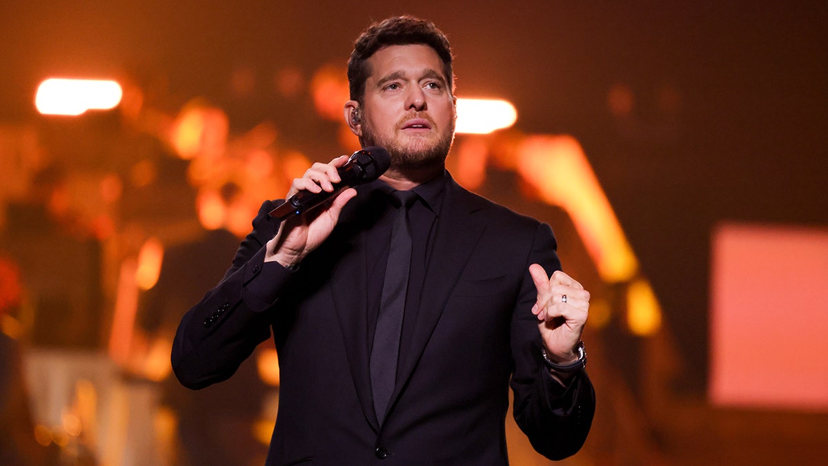 Michael Buble onstage with microphone