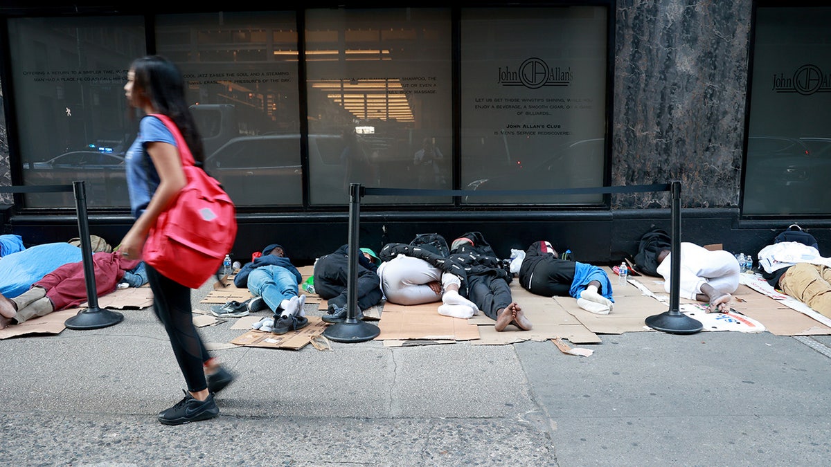 Migrants sleep on the street in New York City