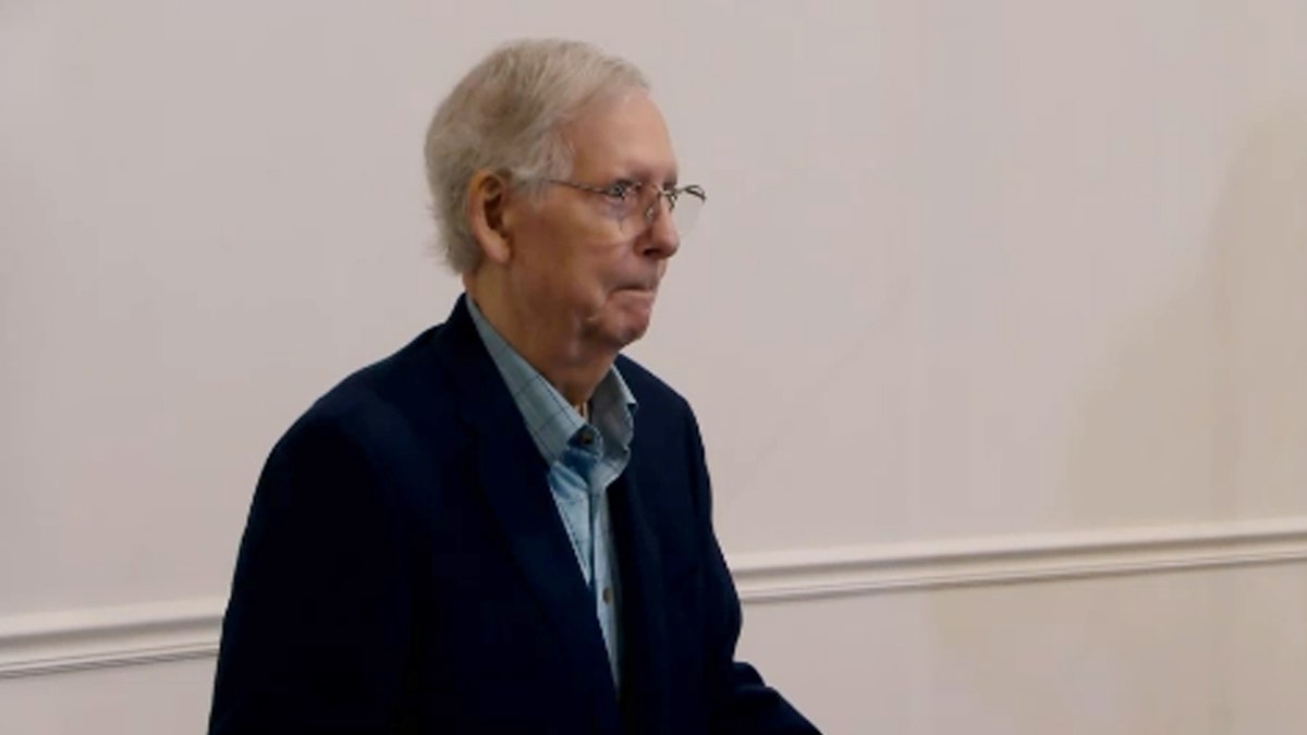 Sen. Mitch McConnell pauses at the podium when asked a question
