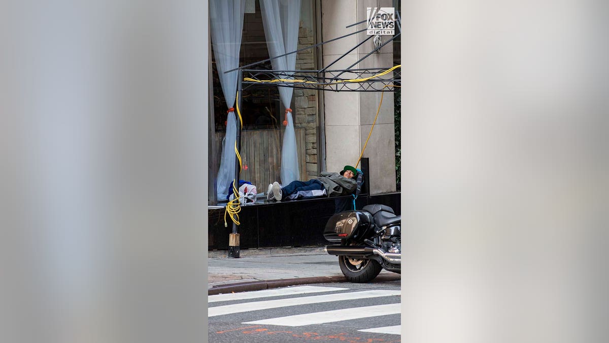 Migrants resting outside Roosevelt Hotel in Manhattan