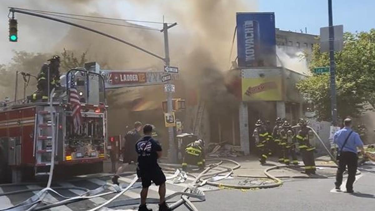 FDNY firefighters battle a fire at 106 Lee Ave. in Brooklyn, N.Y., Sunday, Aug. 20, 2023.