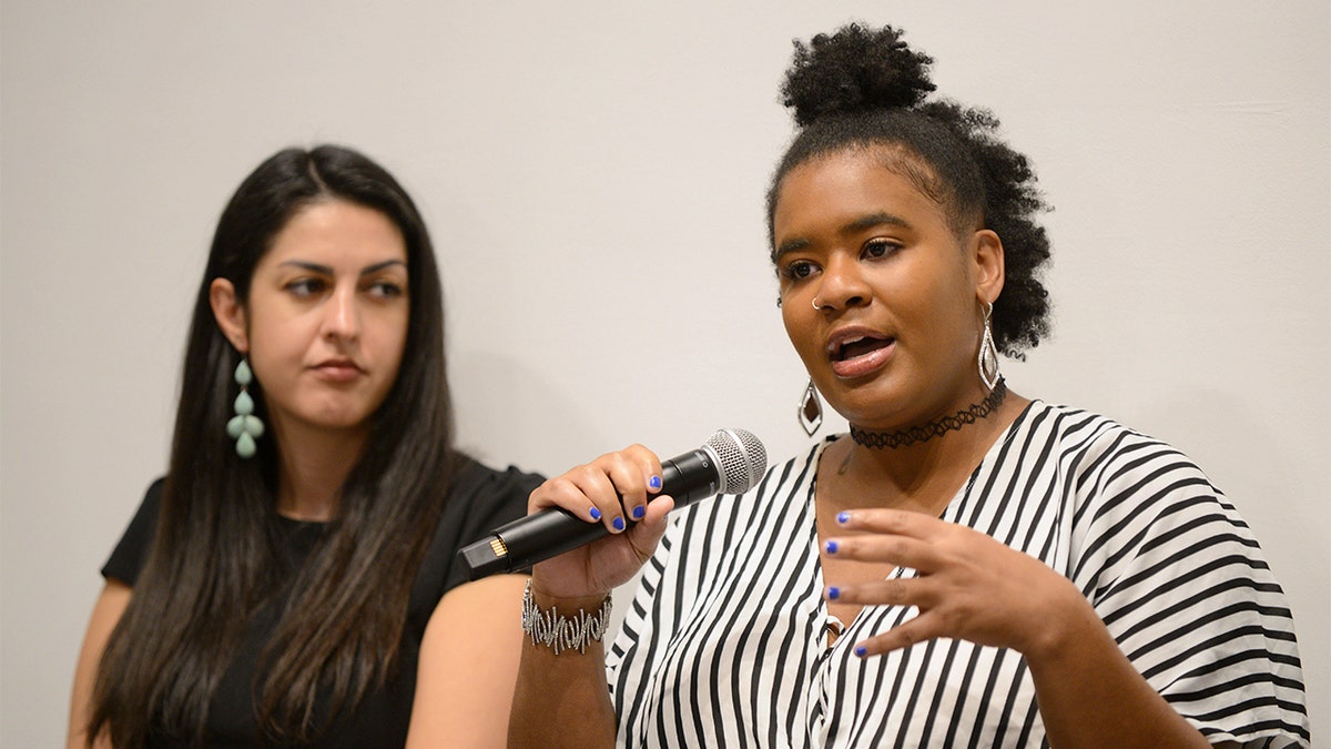 Melanie Thompson speaking at a conference.