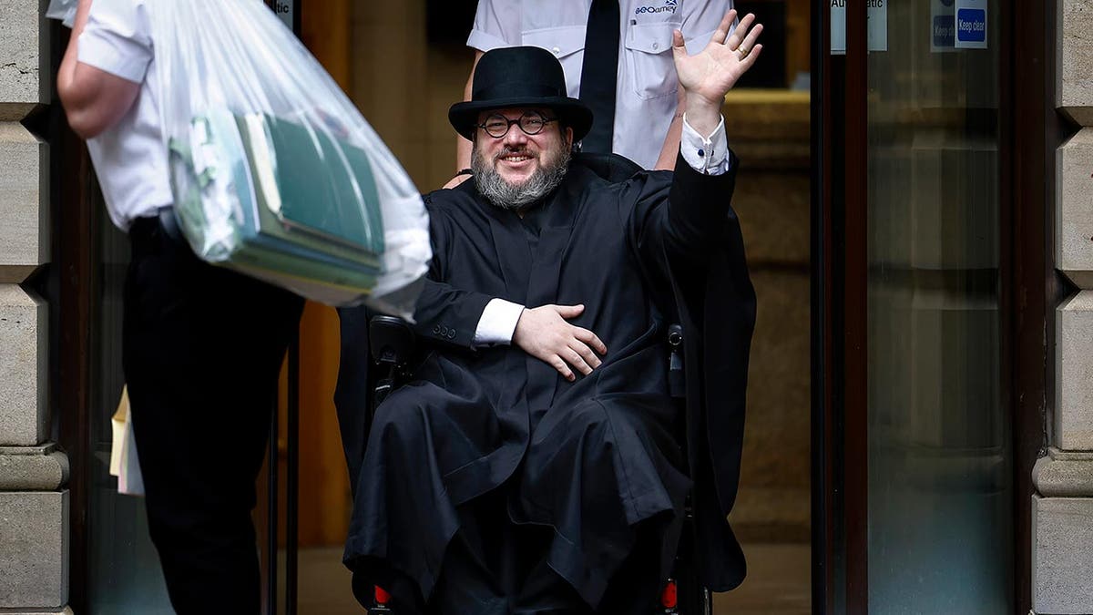 Nicholas Alahverdian/Nicholas Rossi leaves Edinburgh Sheriff Court after his extradition hearing on July 12, 2023, in Edinburgh, Scotland. Rossi, who has insisted he is an Irishman named Arthur Knight, has been fighting extradition to the U.S. over rape allegations.