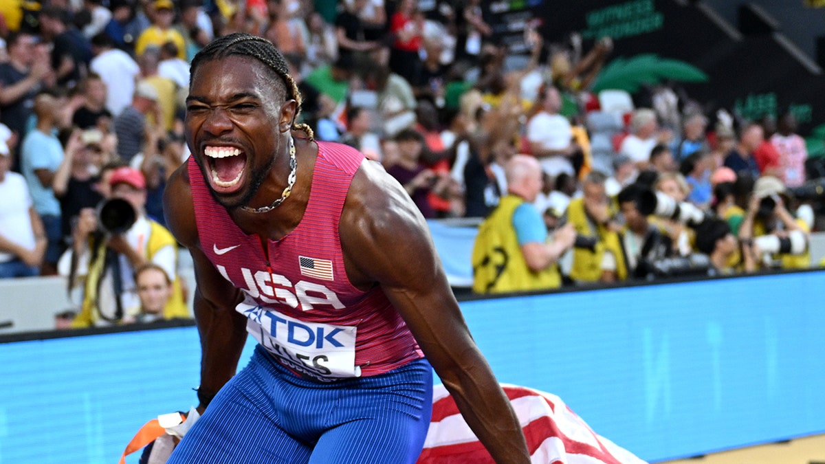 Noah Lyles celebrates