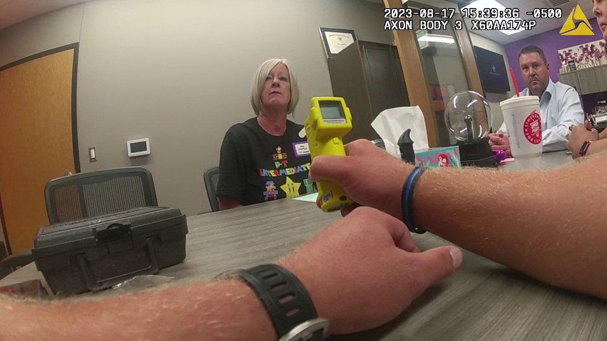 Kimberly Coates taking breath test in school office