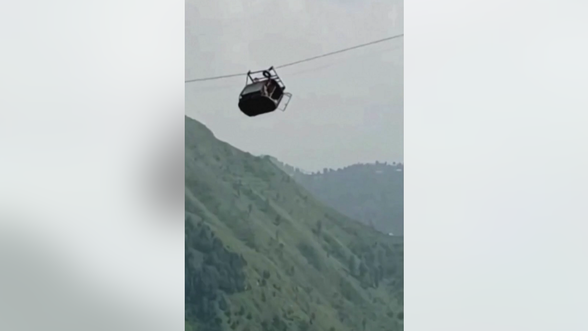 Pakistan gondola dangles in air