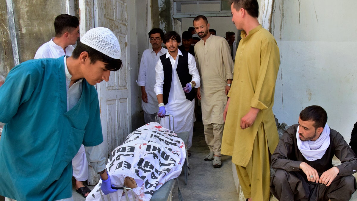 Hospital staff transfers body