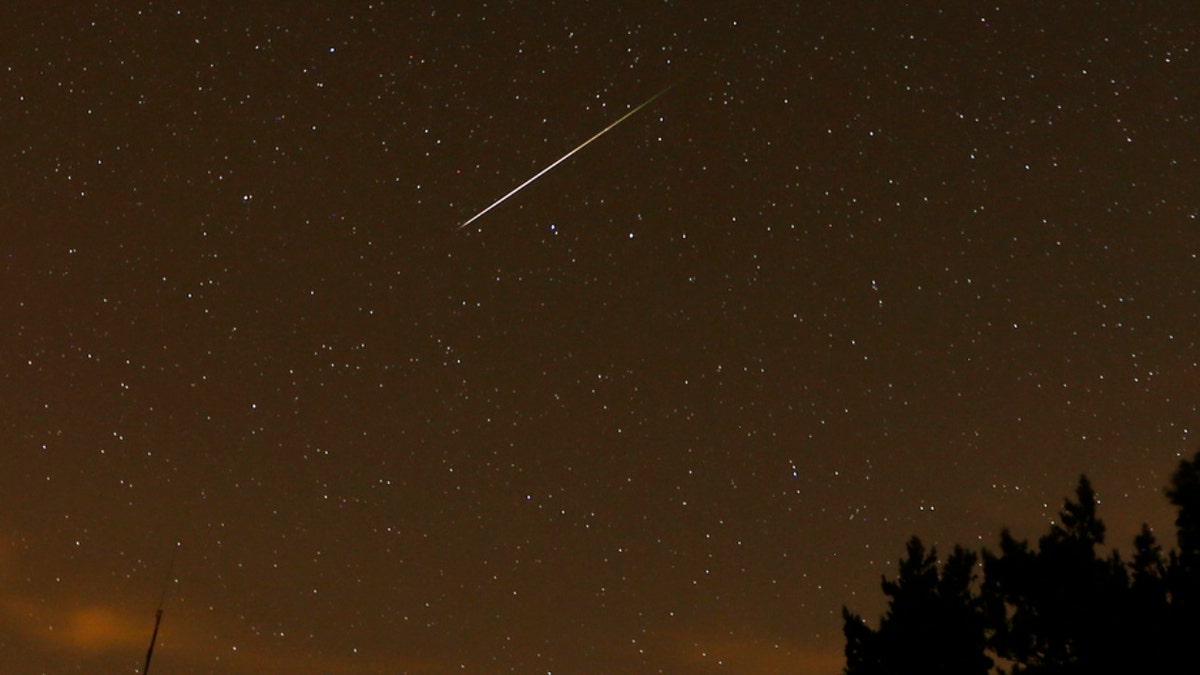 A streak appears in the sky during the annual Perseid meteor shower