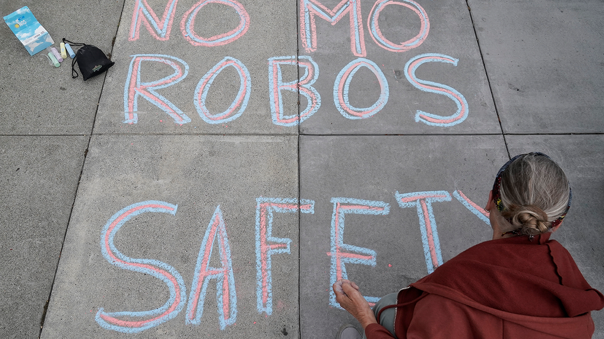 San Francisco sidewalk chalk protest against robotaxis