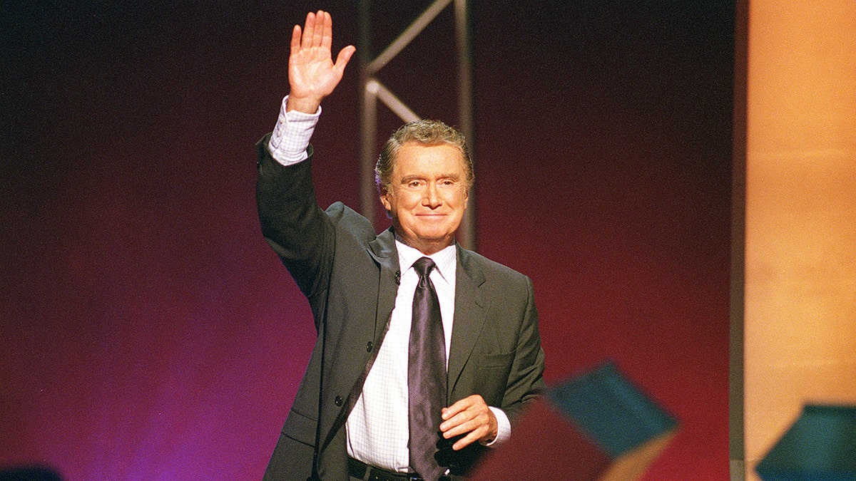 Regis Philbin waving on set of Who Wants to Be a Millionaire