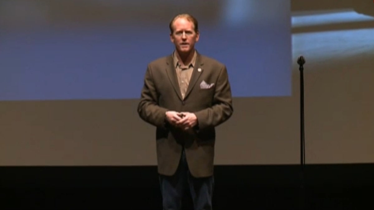 ONeill speaking at a conference.