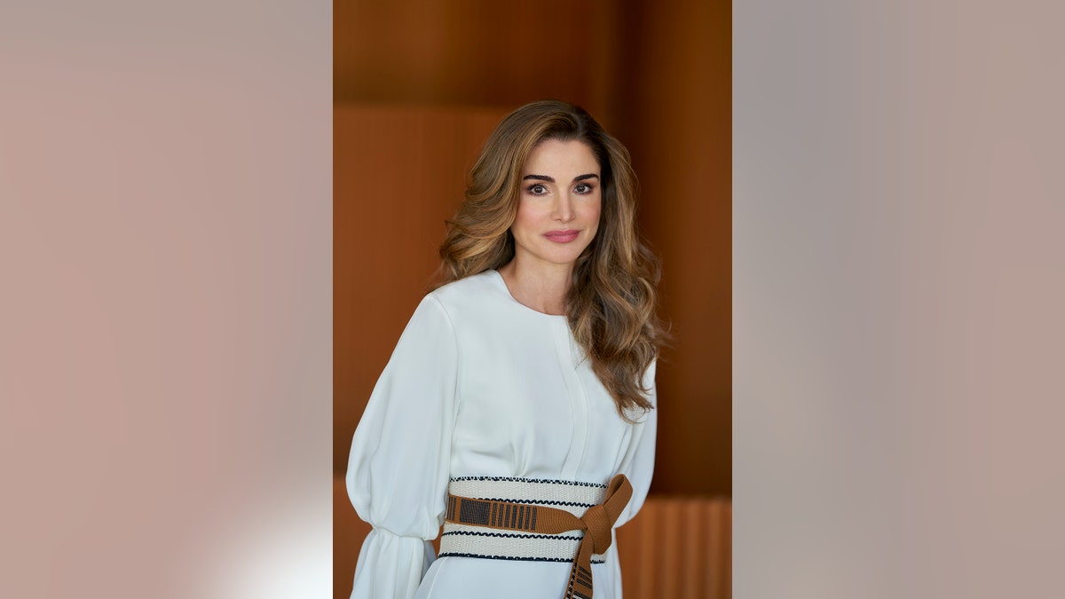 Queen Rania of Jordan wearing a white dress