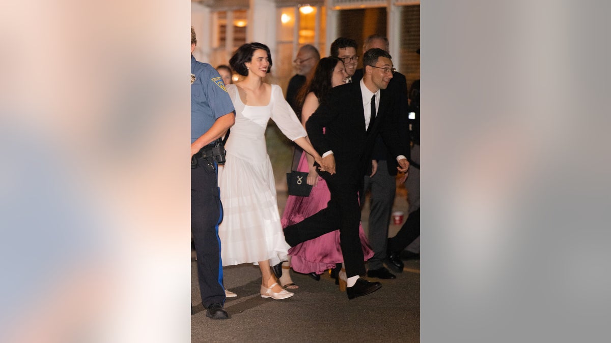 Margaret Qualley and Jack Antonoff run hand in hand after their wedding ceremony