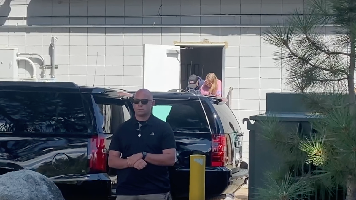 Hunter Biden is photographed ducking his head as he exits the building in Nevada on Wednesday.