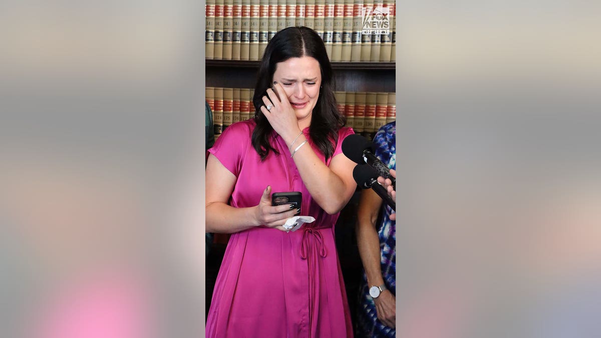 Kirsten Bridegan speaks at a press conference