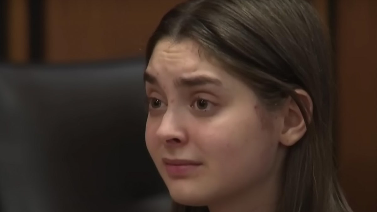 Ohio woman looks emotion in a close up in court.