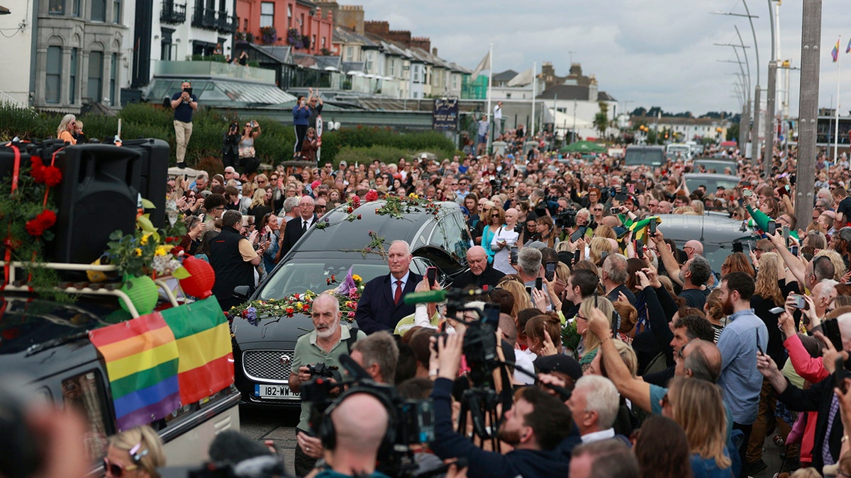 Hundreds of fans pay respects to Sinead O'Connor as her funeral procession passes