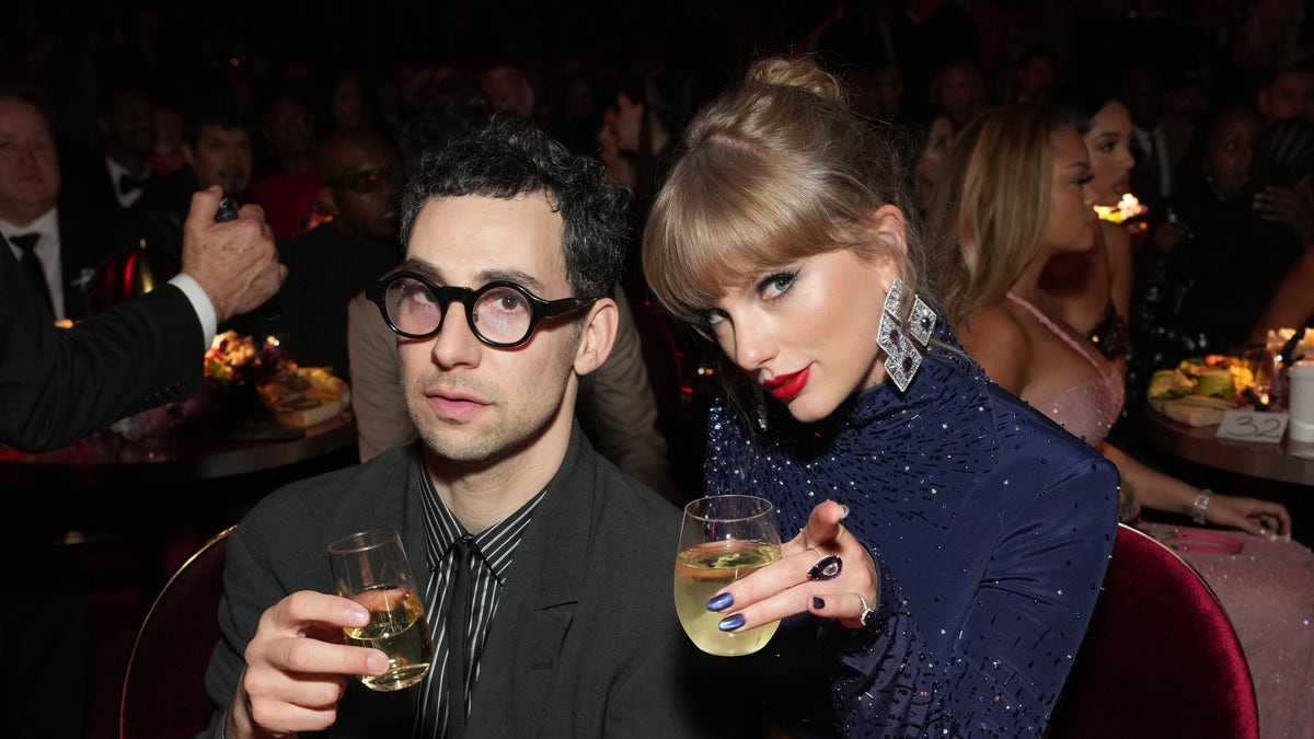 Jack Antonoff and Taylor Swift toast at the Grammys