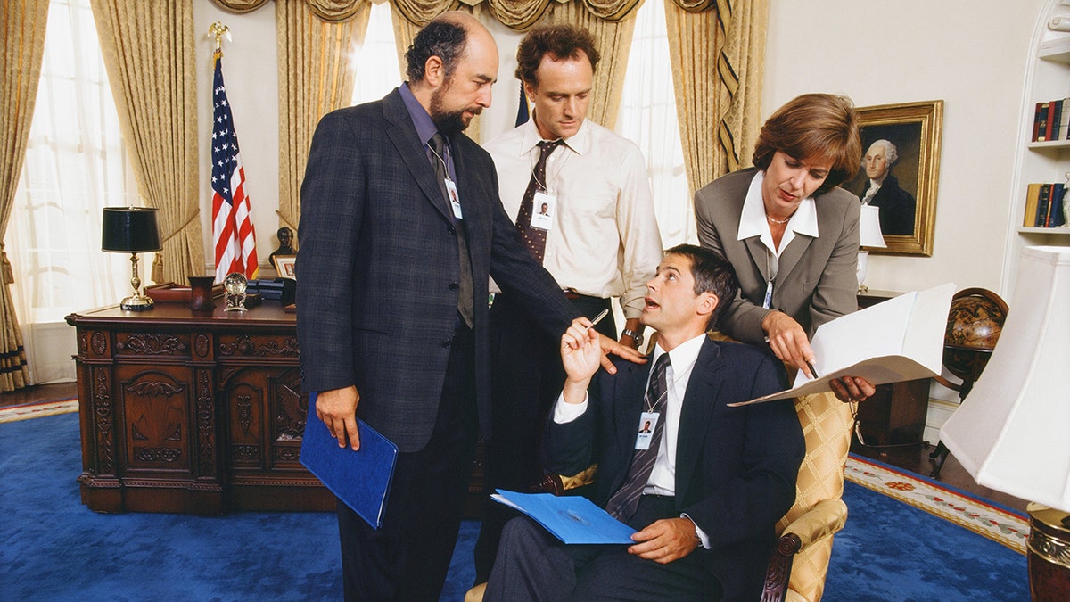 Richard Schiff as Toby Ziegler, Bradley Whitford as Josh Lyman, Rob Lowe as Sam Seaborn and Allison Janney as Claudia Jean 'C.J.' Cregg in "The West Wing."