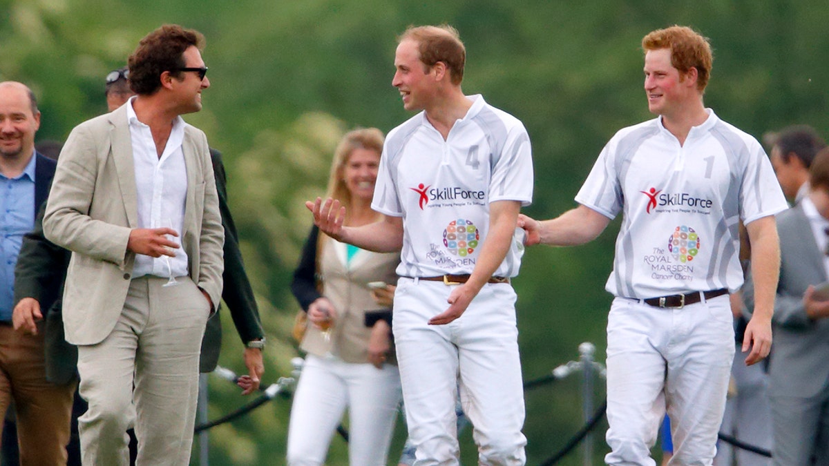 Prince William, Duke of Cambridge and Prince Harry talk with Thomas van Straubenzee 
