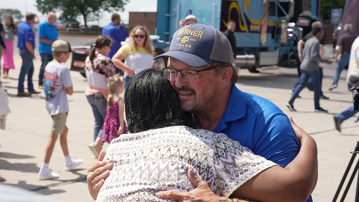 Tim Dean hug Werner Enterprises