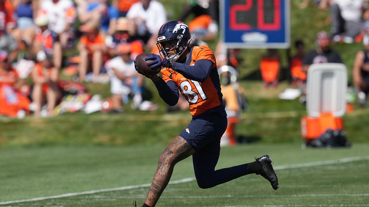 Wide receiver Tim Patrick catches a pass