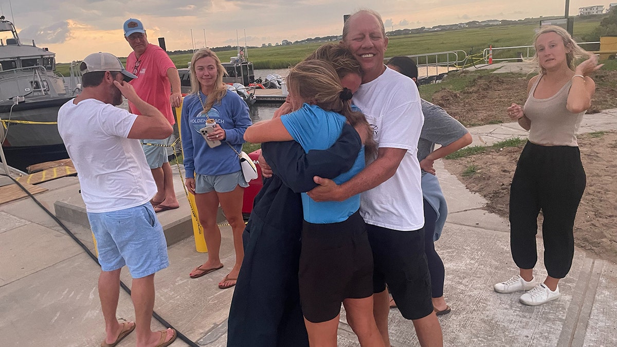divers rescued and reunited