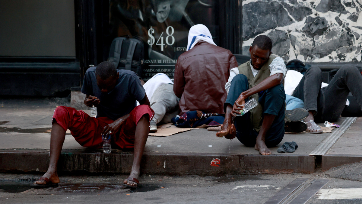 Hundreds of migrants are seen sleeping outside the Roosevelt Hotel in Midtown Manhattan early Monday July 31, 2023. Asylum seekers are camping outside the Roosevelt Hotel as the Manhattan relief center is at capacity. 