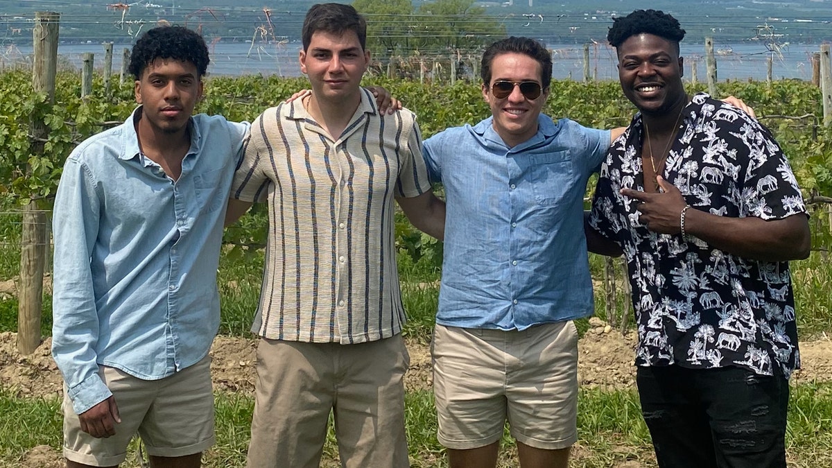 Yohanes Kidane and Austin Farmer in group photo with two other friends