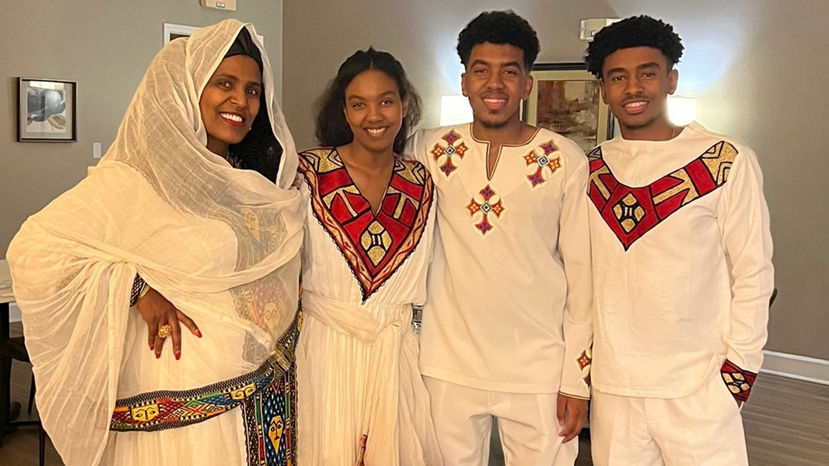 Yohanes and Yosief Kidane pose with mother and sister in family photos