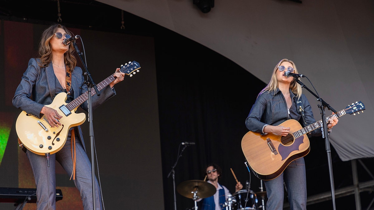 Aly & AJ performing