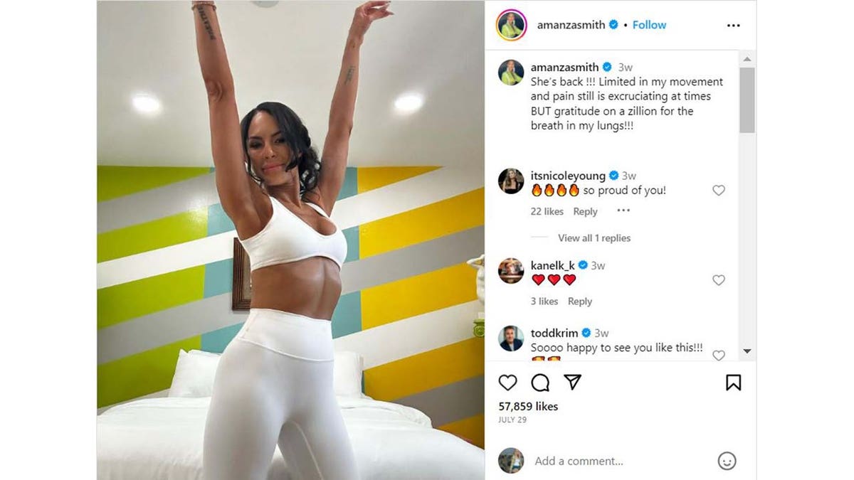 Amanza Smith raising her arms in victory on Instagram