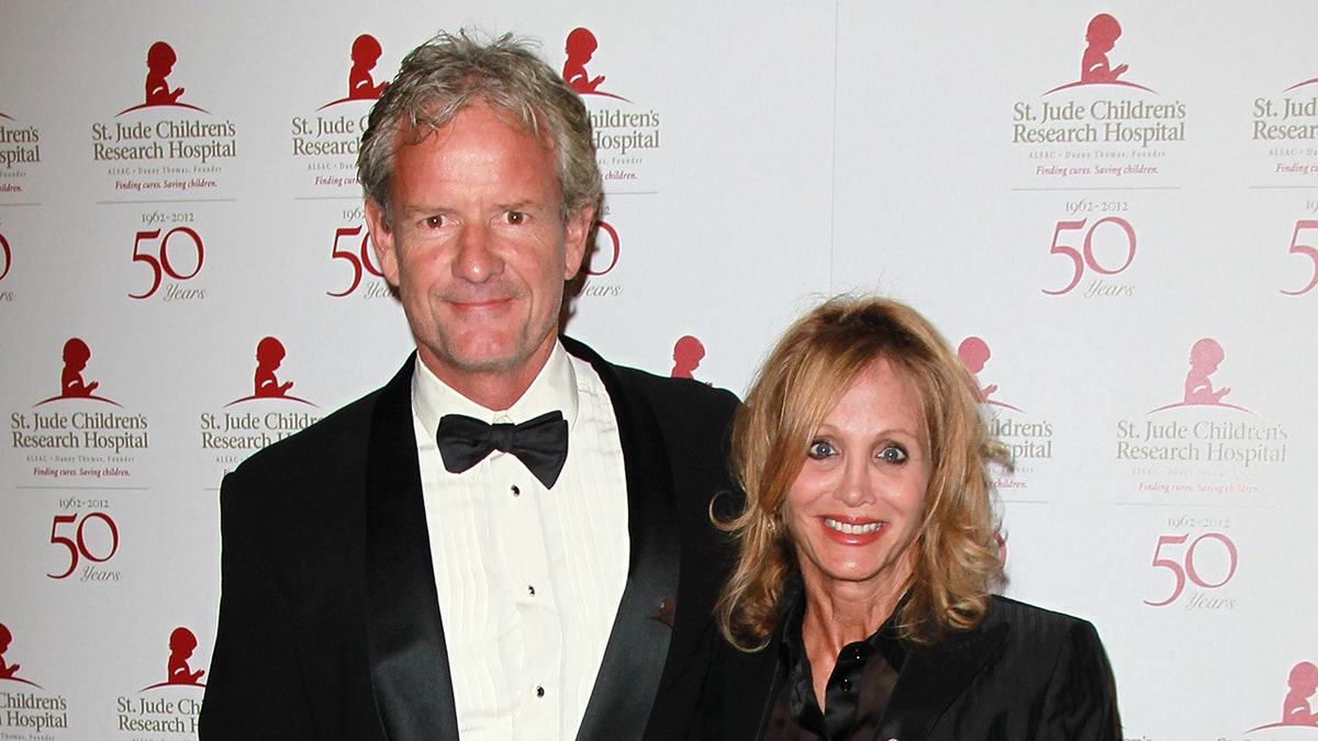 Christopher Lloyd and wife Arleen Sorkin walk red carpet in black tie ensembles