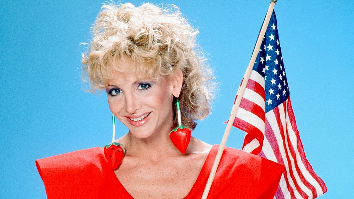 Days of Our Lives actress Arleen Sorkin holds American flag in portrait