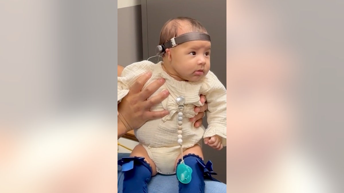 Baby hears for the first time