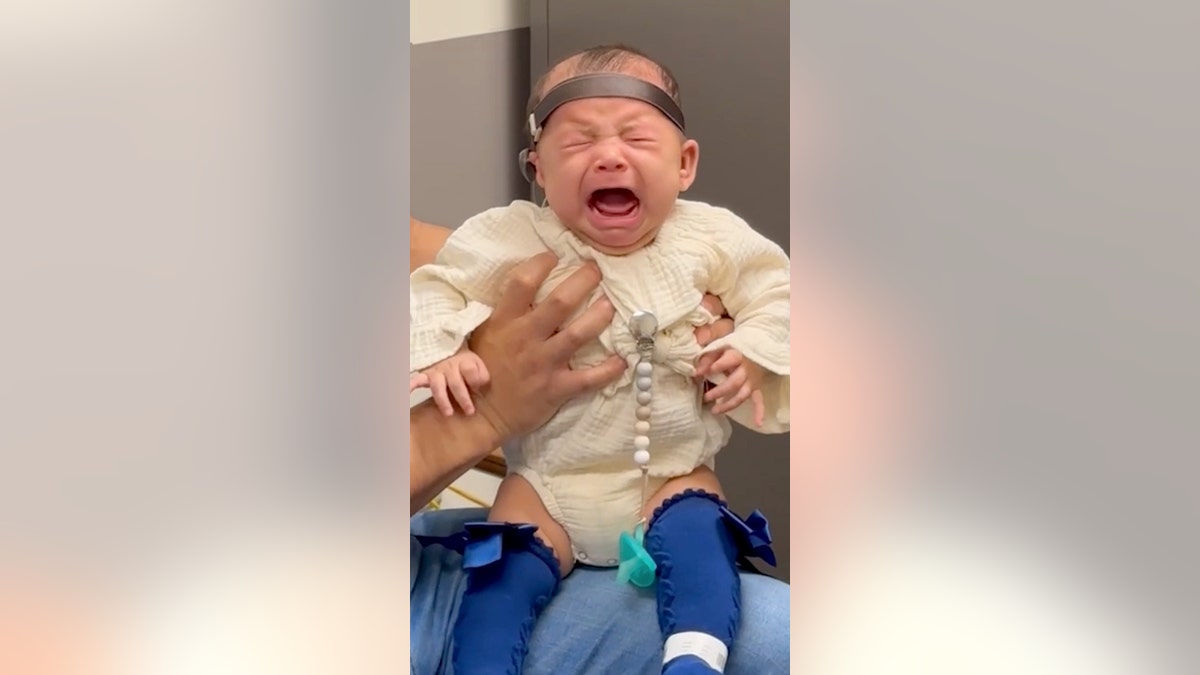 Baby hears for the first time