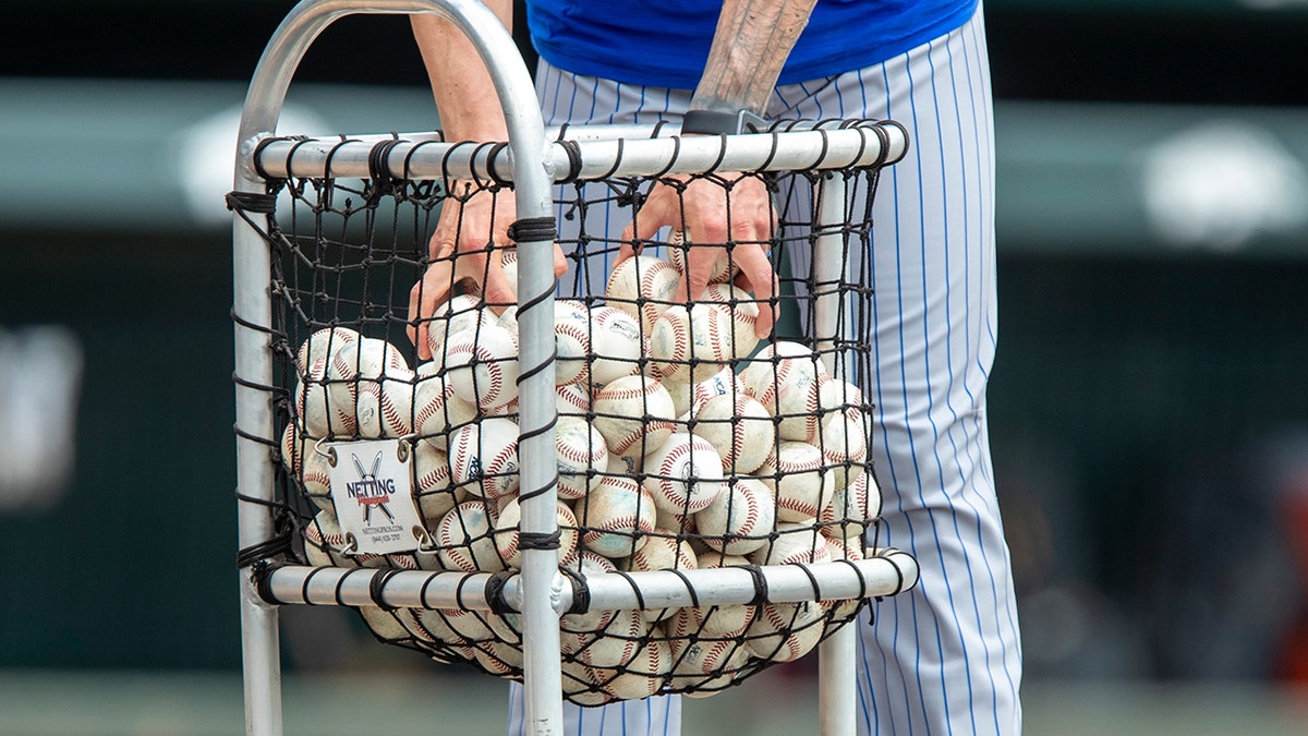 A basket filled with baseballs